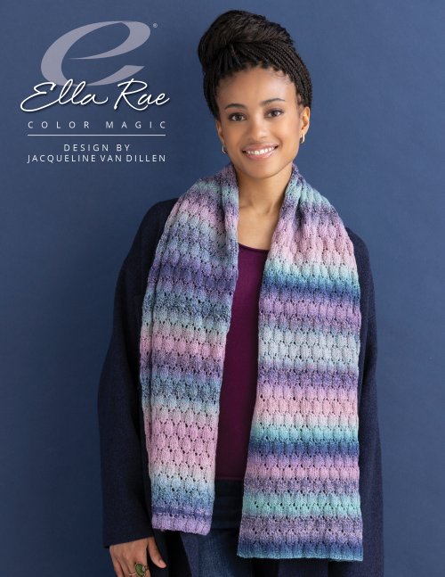 Woman wearing a lace scarf knit in Ella Rae Color Magic yarn in Pretty in Pink (510), striped lilac, aqua, and navy