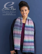 Woman wearing a lace scarf knit in Ella Rae Color Magic yarn in Pretty in Pink (510), striped lilac, aqua, and navy